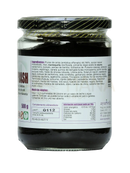 Ein glas gefüllt mit dunklem, dickem paste chyawanprash ayurveda klassisches ayurveda kräuterelixier mit amla 500g