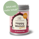 Glückliche Frau mit Bio-Gewürzmischung von Classic Ayurveda, zeigt die Gewürze in einer bunten Mischung in der Hand.