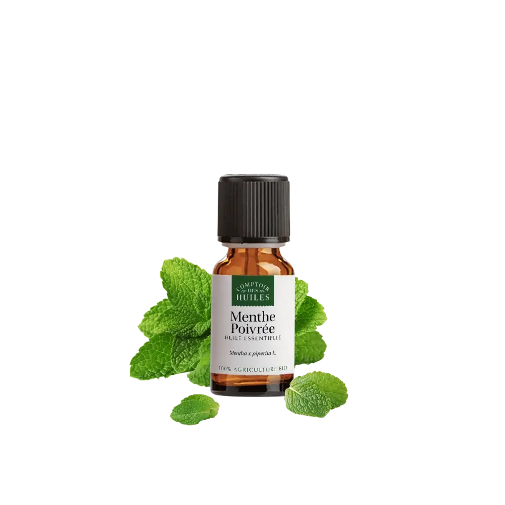 Kleine bernsteinfarbene glasflasche mit schwarzem rippverschluss und etikett menthe poivrée huile essentielle von comptoir des huiles bio ätherisches organisches pfefferminzöl