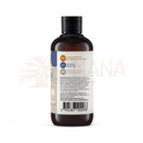 Dark amber glasflasche mit schwarzem deckel und weißem etikett für comptoir des huiles haarspülung mit ximenia öl und veganen eigenschaften