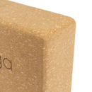 Ein tanfarbener kork yoga-block mit abgerundeten rutschfesten kanten und strukturierter oberfläche von mana shop