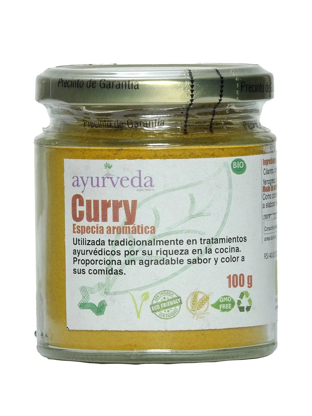 Aromatische Curry-Gewürzmischung von Ayurveda Auténtico, Gewürze in einer offenen Gewürzdose mit bunten Curry- und Gewürzstücken