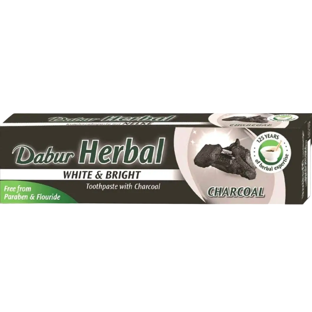Dabur ayurvedische zahnpasta mit aktiviertem holzkohle in schwarzer und weißer tube mit grünen akzenten bei mana shop