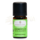 Ein kleines bernsteinfarbenes glasfläschchen mit schwarzem verschluss und grünem etikett damascena lemonmyrtle bio ätherisches öl für aromatherapie und wohlbefinden