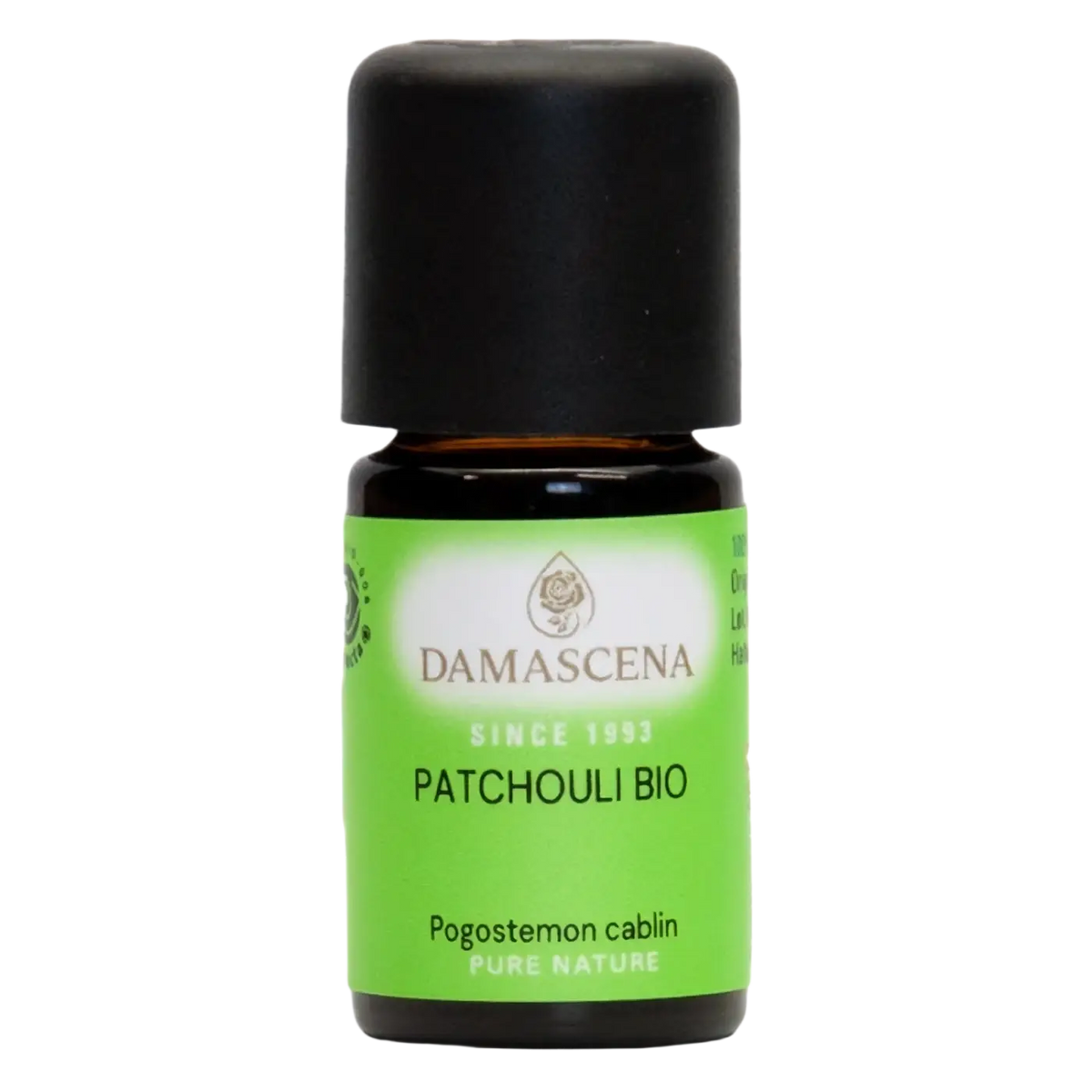 Kleine bernsteinfarbene glasflasche mit schwarzem deckel und grünem damascena patchouli bio etikett patchouliöl 5 ml pogostemon cablin