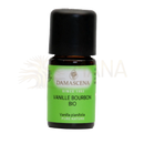 Kleine bernsteinfarbene glasflasche mit schwarzem deckel und grünem label damascena vanille bourbon bio ätherisches öl 5 ml