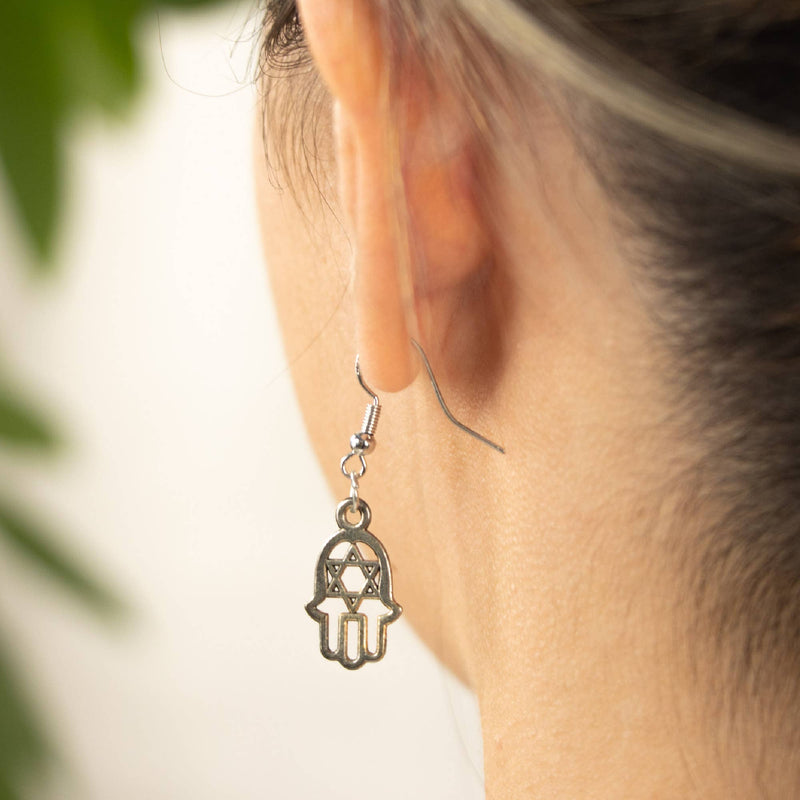 Hamsa earrings with lotus and Om – symbolism and style combined