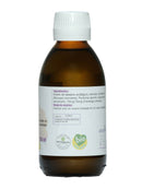 Dunkle Glasflasche mit weißem Deckel und weißem Etikett. Das Etikett listet Inhaltsstoffe wie Bio-Sesamöl und Brahmi-Extrakt sowie Anwendungshinweise für die Kopfhautmassage auf.