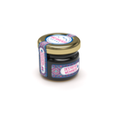 Ein kleines Glas Mad Shilajit Nepal mit der Aufschrift „Destroyer of Weakness“ auf dem Etikett.