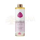 Eine klare glasflasche mit goldenem verschluss enthält eliah sahil bio luxuriöses pflanzenöl jojoba rose für haut und haar von mana shop
