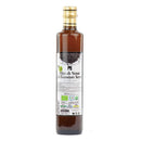 Eine hohe Glasflasche mit biologischem Schwarzkümmelöl von Erbavoglio vor weißem Hintergrund.