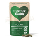 Grünes und beiges pouch mit zusammen health folat natürlichen verbindungen kapseln und drei grünen kapseln daneben