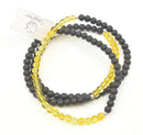 Kurzes Mala aus Ebenholz und Citrin, handgefertigter Schmuck von GangaPrem, mit schwarzen Holzperlen und gelben Citrin-Perlen.