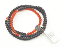 Kurzes Mala aus Ebenholz und Karneol von GangaPrem, detailreiche Schmuckkette mit natürlichen Edelsteinen.