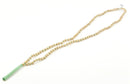 Goldene Tulsi-Mala aus Schmuck von GangaPrem mit natürlichen Tulsi-Perlen, handgefertigt und traditionell gestaltet.