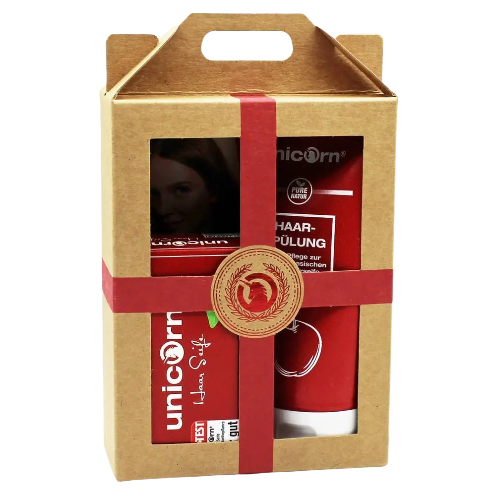 Geschenk-Set von Spa Vivent mit roter Unicorn-Haarseife (100g) und Spülung (150ml für Körperpflege) auf weißem Hintergrund.