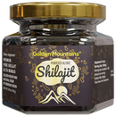 Dunkles glasgefäß mit goldenem deckel und label golden mountains shilajit harz hochwertiges shilajit resin berge