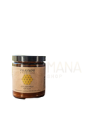 Ein glas paavani ayurveda goldene milch mit schwarzem deckel und beigem etikett für gesundheit im mana shop