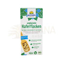 Eine packung govinda angekeimte haferflocken in weiß grün mit blauen mustern glutenfreie braune millet flakes bio