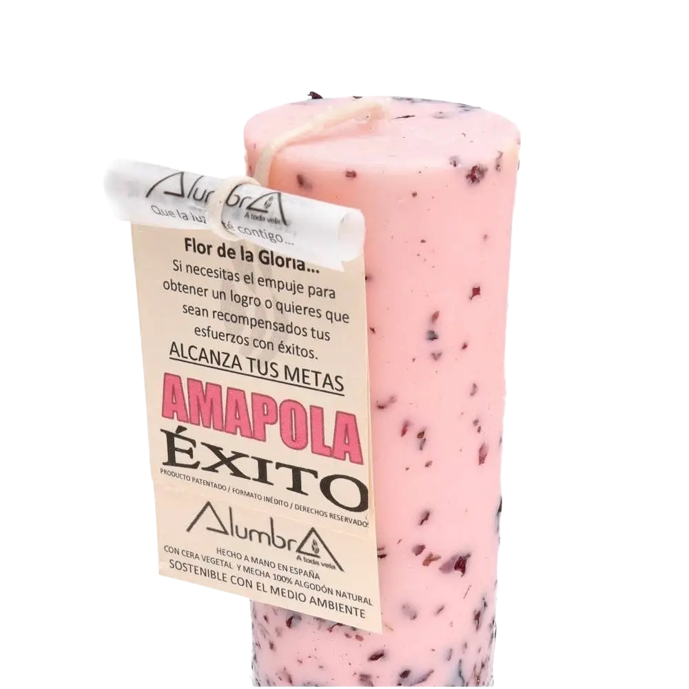 Handgefertigte pinke zylindrische kerze mit dunklen punkten und label amapola éxito von alumbra für erfolg