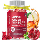 Eine Flasche Harmonify Apfelessig-Gummibärchen, mit einem Maßband um den Hals, Äpfeln, Granatapfel und Saftspritzern, was auf Vorteile beim Gewichtsmanagement und reiche Fruchtingredienzen hindeutet.