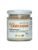 Ein klares glas mit weißem deckel enthält 200g ayurveda kala namak himalaya schwarzes salz natürliches mineralreiches salz