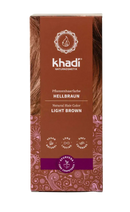 Khadi Pflanzenhaarfarbe Hellbraun, 100g, natürliche Haarfarbe für schöne, glänzende Haare, umgeben von Naturkosmetik-Elementen.