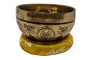 Klangschale buddha shakyamuni handgravierte bronze mit mantra auf gelbem kissen tibetische singing bowl