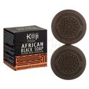 Dunkelbraune kreisförmige african black soap mit mandala relief und packaging von koji white mit kojic acid und haferflocken
