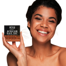 Ein schwarzer rechteckiger bar Koji White african black soap mit orangefarbenen geometrischen Mustern und weißem Text auf der Verpackung