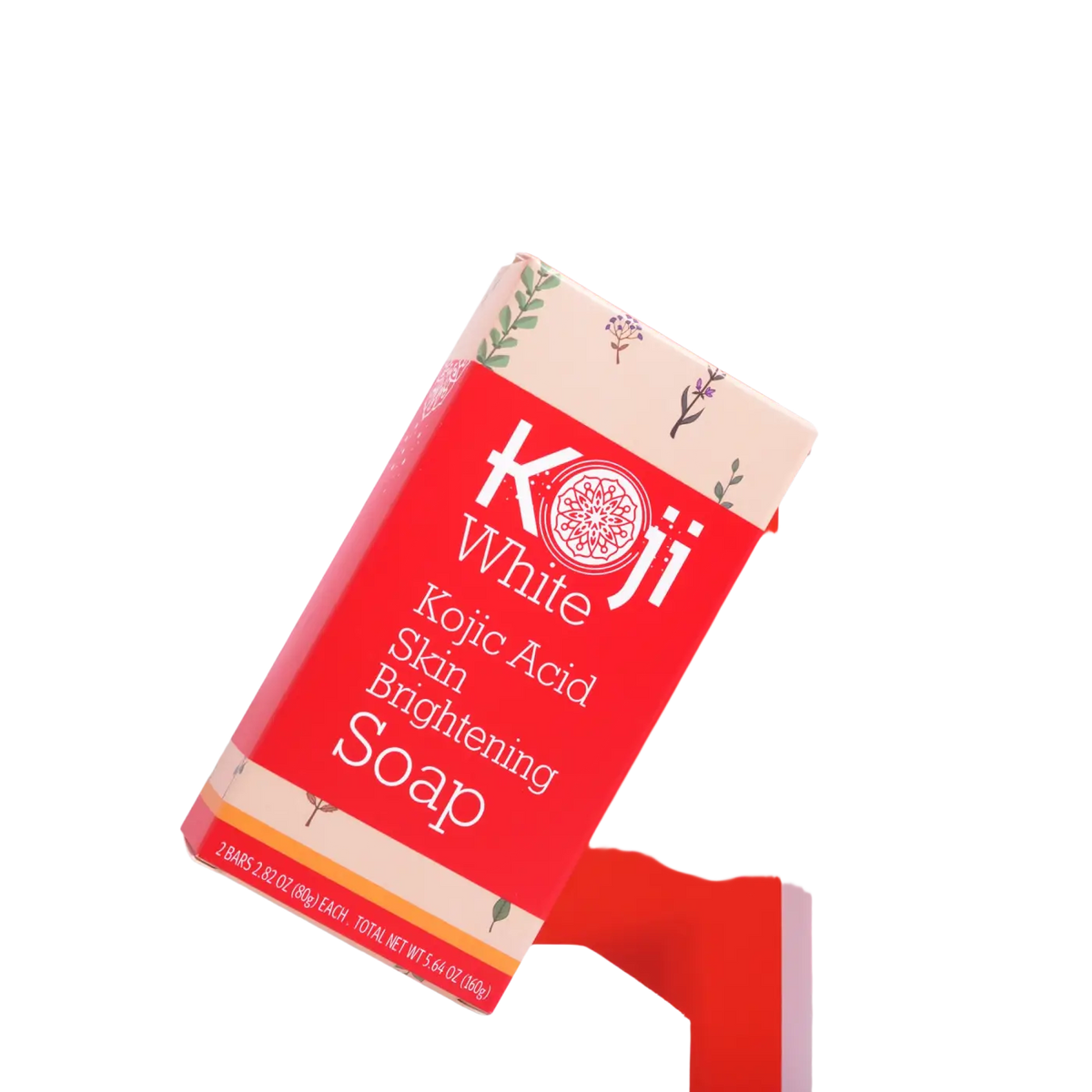Reine hautaufhellende Seife von Koji White mit Kojisäure, rot-beige Töne, zeigt die Seife in einer stilvollen Verpackung.