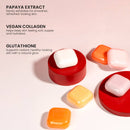 Mehrere farbige Seifenstücke auf roten Sockeln neben Textbeschreibungen von Papaya-Extrakt, veganem Kollagen und Glutathion.
