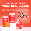Leuchtend orangefarbene Anzeige für die hautaufhellende Seife mit Kojisäure. Enthält Seifenstücke, eine Molekülillustration und die Behauptung, dunkle Flecken und Sommersprossen zu reduzieren.