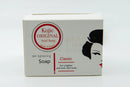 Weiße rechteckige box mit kojic original acid seife und rotem logo für einen ebenmässigen teint bei mana shop