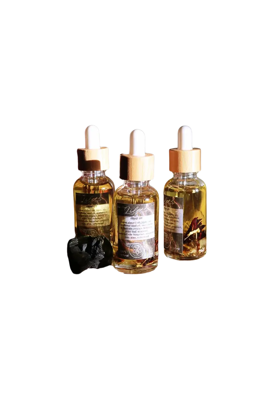 Ätherisches Lilith Öl von Ayamani Naturals mit Mondstein- und Tigeraugenkristallen, für feminines Ritual und spirituelle Energie.