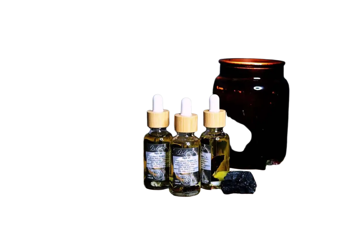 Ätherisches Lilith-Öl von Ayamani Naturals mit Mondstein- und Tigeraugenkristallen, feminines Ritualöl für spirituelle Harmonie.