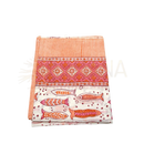 Folding of a vibrant lunghi sarong with orange and pink fish motifs on white ground from mana shop