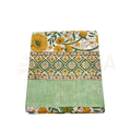 Folding of a cotton lunghi sarong with vibrant yellow and green floral motifs and geometric stripes from mana shop