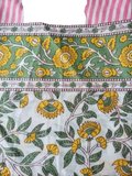 Vibranter grüner und gelber lunghi sarong mit rosa weiß gestreiftem rand bei mana shop erhältlich