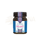 Ein braunes glasgefäß mit schwarzem deckel und dekorativem blauen rosa weißen etikett mad honey nepal himalayan cliff honey 250 g