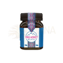 Ein dunkles braunglasglas mit schwarzem geripptem deckel und blau-weißem etikett mit pinken mustern mad honey nepal cliff honey