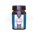 Braunes glasgefäß mit schwarzem gewindedeckel und blau-pink-weißem etikett mad honey nepal traditionell geernteter honig
