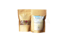 Zwei braune nachfüllbare pouches ayamani naturals manifest tee mit klaren fenstern ideal für meditation