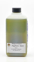 Eine transluzente grüne flasche mit schwarzem deckel midgard kalari hagebutte-milch thailam 500ml kühlendes öl