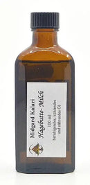 Dunkle bernsteinfarbene glasflasche mit schwarzem rippverschluss und weißem etikett mit 100 ml midgard kalari hagebutte-milch thailam öl von mana shop
