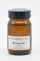 Mittelgroße Flasche mit Midgard Kalari Rizinusöl, ein ayurvedisches Spezialöl für Haut- und Haarpflege, transparent und goldfarben.