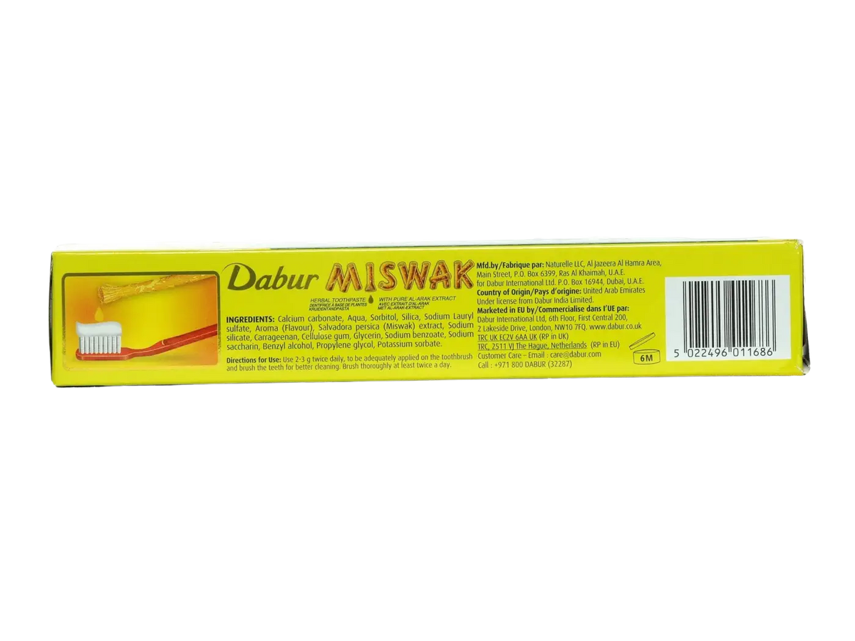 Gelbe rechteckige box von dabur misak ayurvedische zahnpasta mit natürlicher zahnpflege und miswak-stick grafik