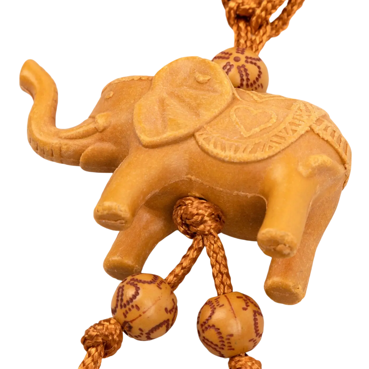 Myga Eco Schlüsselanhänger aus geschnitztem, goldbraunem Schmuckmaterial, handgefertigt und stilvoll.