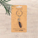 Schlüsselanhänger aus Schmuckmaterial von Myga Eco, nachhaltiges Accessoire mit stilvollem Design, in der Nähe liegend.