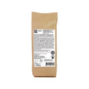 NaturKraftWerke Lupinenkaffee Demeter, frisch gebrühter Kaffee in einer Tasse, umgeben von Lupinenblüten auf einem Holztablett.